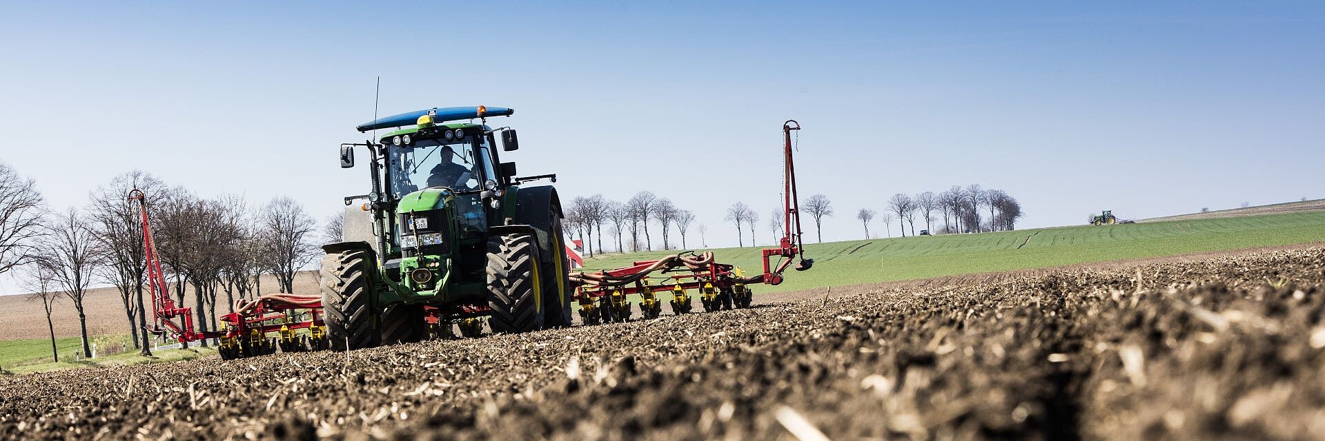 Sowing sugar beets with a John Deere tractor