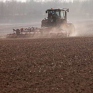 Tractor works the soil